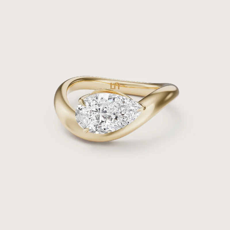 Radiant - cut diamond engagement ring with a bezel - set center stone in 18K yellow goldLilia Pear Solitaire