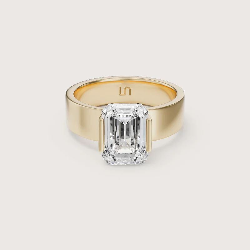 Emerald - cut diamond engagement ring set in a modern titanium bandSfera Emerald Flat Band Solitaire