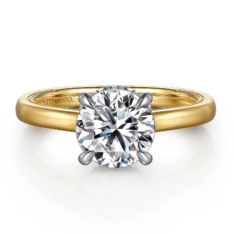 Solitaire diamond engagement ring with a platinum setting for a classic and elegant lookSandi Round Diamond Engagement Ring Setting with Hidden Halo in Yellow Gold