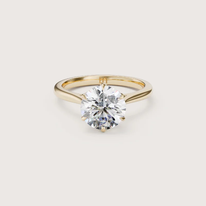 Cushion - cut diamond engagement ring with a halo of moissanite in a silver - plated bandOlbia Round Solitaire