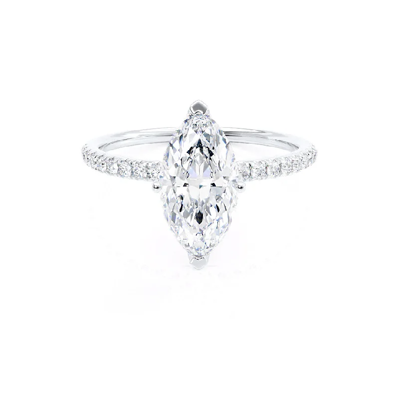 Three - stone diamond engagement ring in rose gold, symbolizing past, present, and futureMACY - Marquise Moissanite 950 Platinum Petite Solitaire Ring