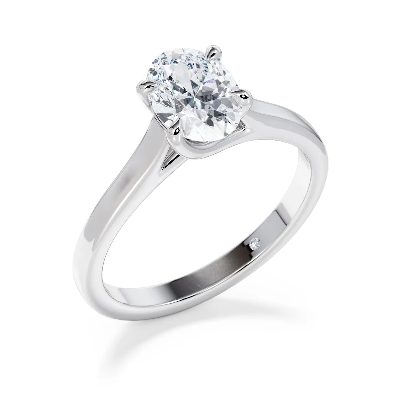 Three - stone diamond engagement ring in rose gold, symbolizing past, present, and futureFinsbury