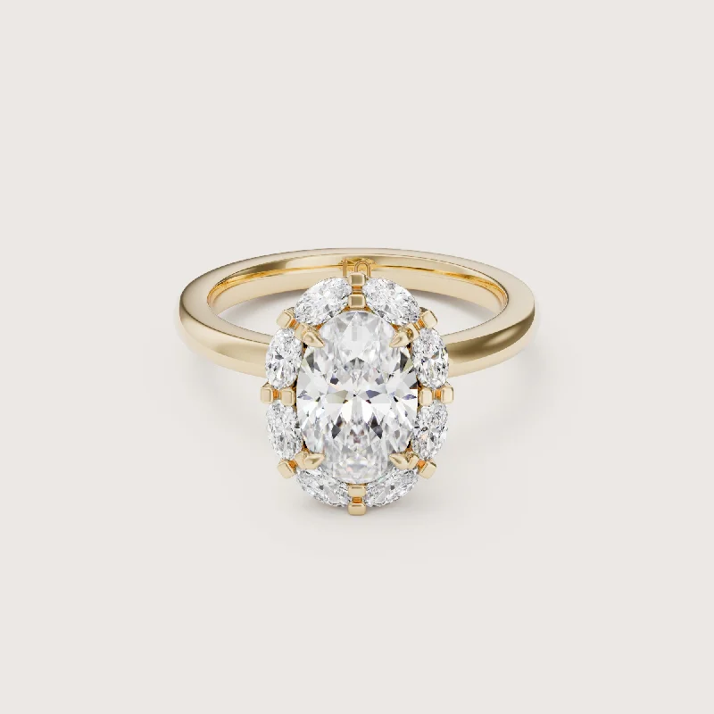 Radiant - cut diamond engagement ring with a bezel - set center stone in 18K yellow goldLouis Oval Halo