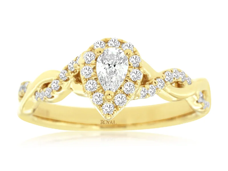 Solitaire diamond engagement ring with a platinum setting for a classic and elegant lookPear Shaped Diamond Halo Crossover Engagement Ring in 14k Yellow Gold, 0.85cttw