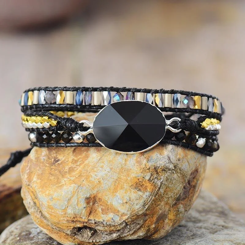 Wrap Bracelets with Tribal Patterns for a Cultural FlairOnyx Charm Wax Cord Wrap Bracelet