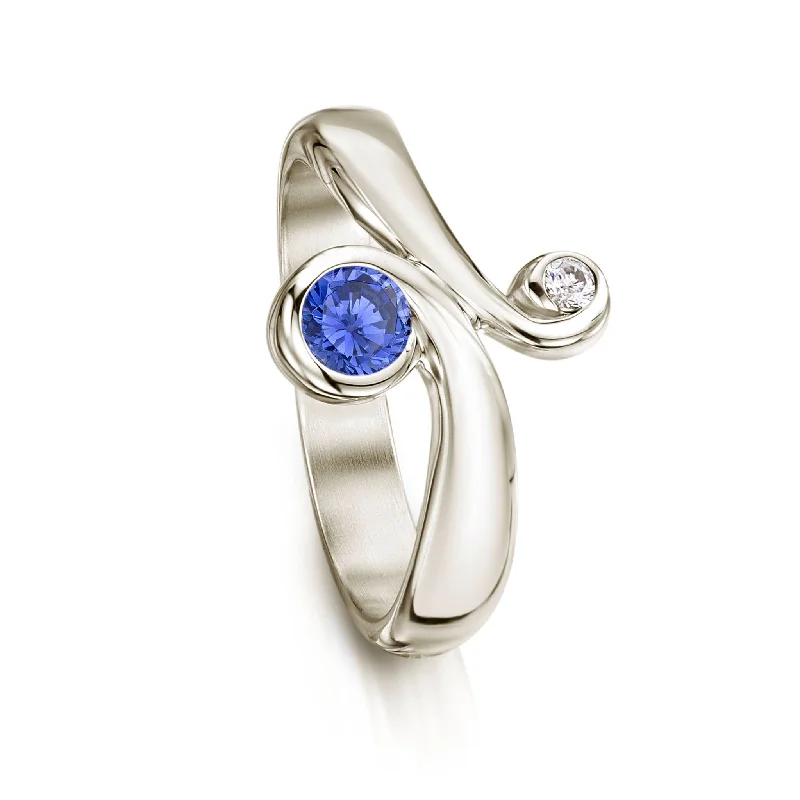 Cushion - Cut Halo Engagement Rings with a Platinum Band and Micro - Pave Details9ct White Gold Swirl Ring with Tanzanite