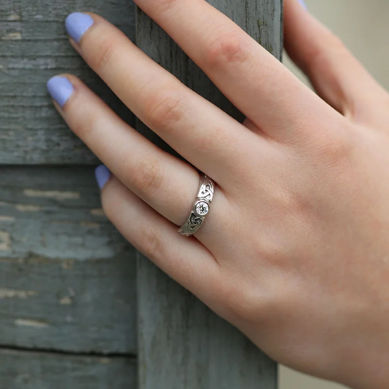 Adjustable Engagement Rings with a Flexible Band and a Princess - Cut Center DiamondCeltic Knotwork Diamond Solitaire Ring in Platinum