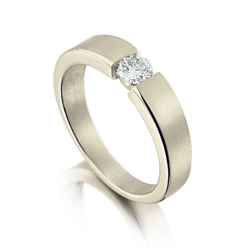 Cathedral - Style Engagement Rings with a Raised Center Stone and Intricate MetalworkTension-style 0.25ct Diamond Solitaire Ring in 18ct White Gold